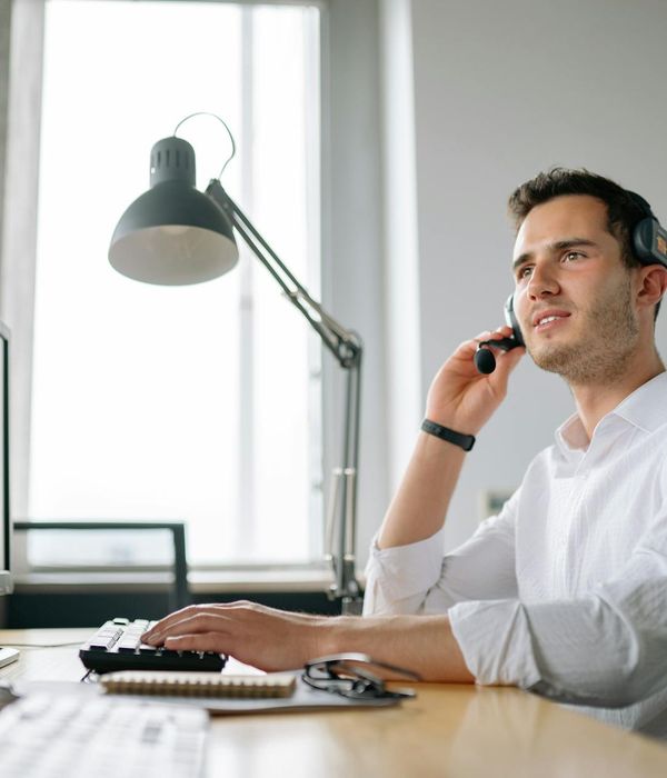 Customer support specialist providing 24/7 assistance via phone and computer