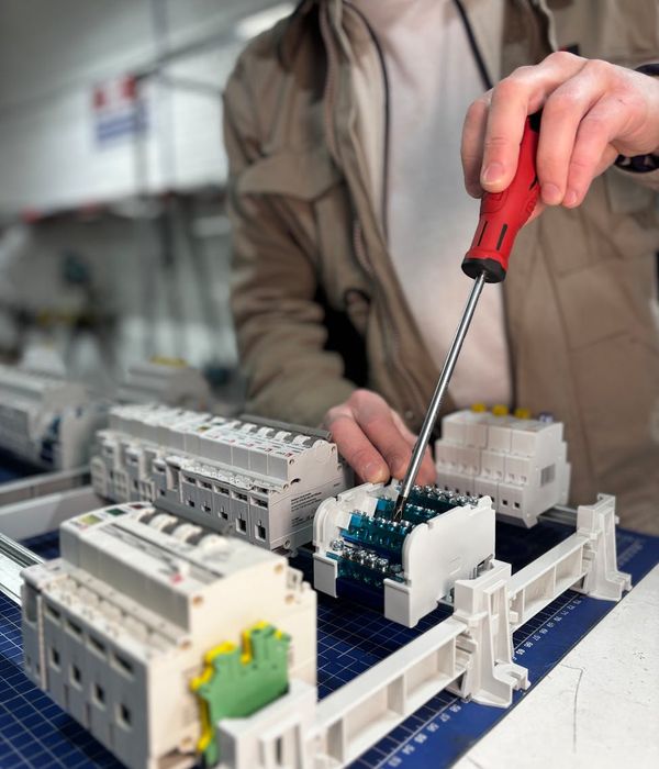 Expert craftsman installing electrical wiring in modern apartment